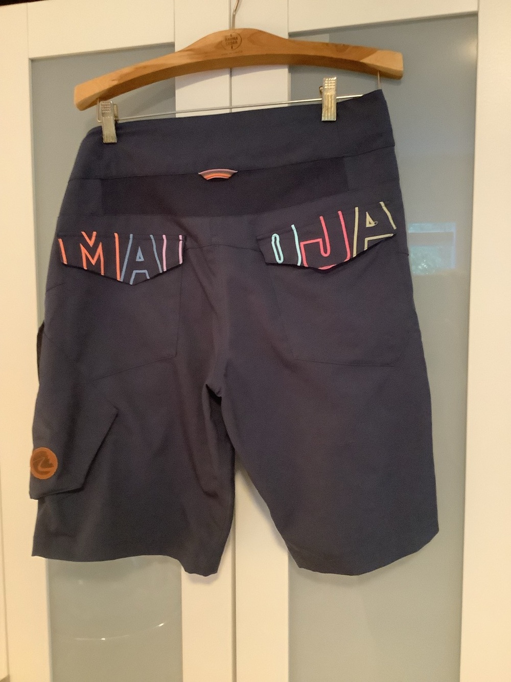 Maloja navy mountain bike shorts with multicolor logo trim